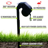 Black dog leash holder with grass and ground stake at the bottom