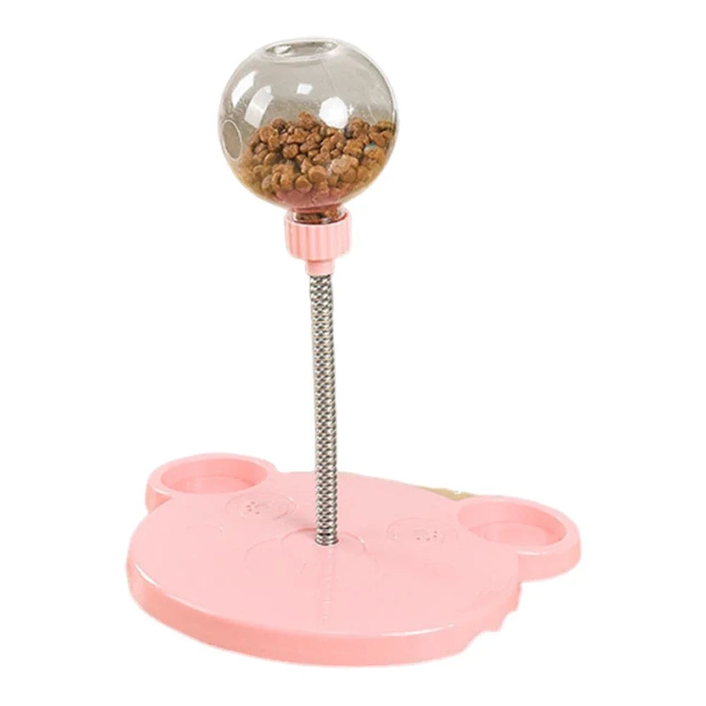 Pink pet toy with a transparent ball containing treats on a white background